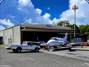 Schweiss bifold door installed on Pacific Mission Aviation hangar