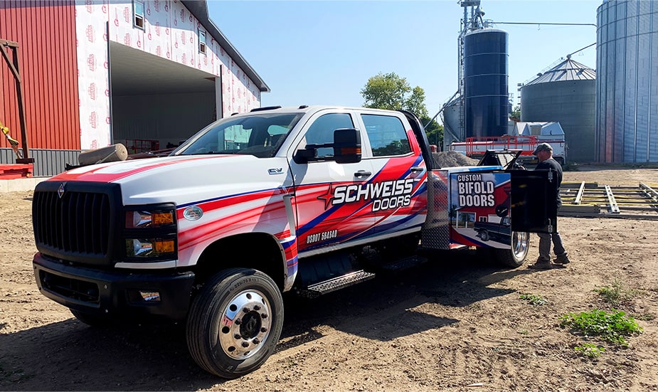 Schweiss installer truck parked on a job site