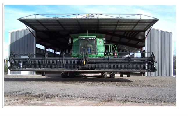 large combine leaving through Schweiss hydraulic door