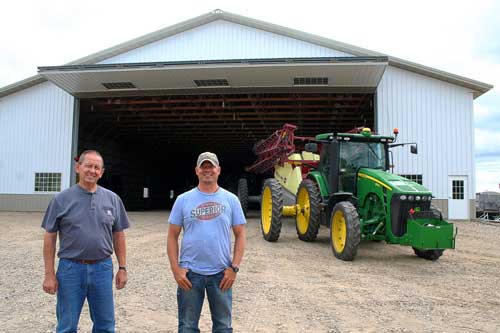 Tractor exiting Schweiss Storage Building Doors 