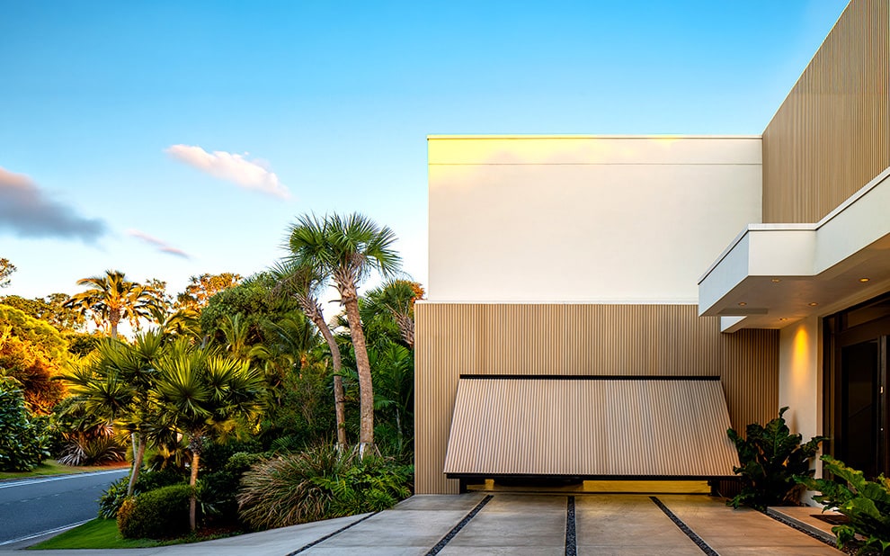 Schweiss hydraulic door fitted on luxury garage in Florida shown opening