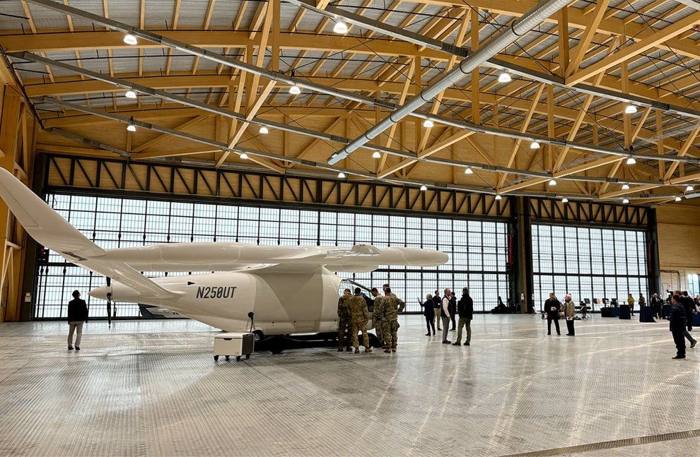 Plane parked inside hangar fitted with 120ft wide by 27ft tall and 50ft wide by 27ft tall Schweiss hydraulic doors