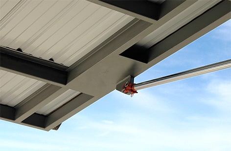 Closeup of Schweiss hydraulic cylinder attached to opened hydraulic door