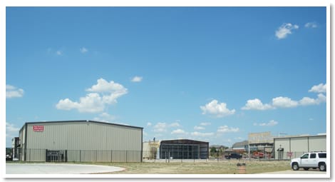 Airpark grounds with Schweiss hydraulic doors