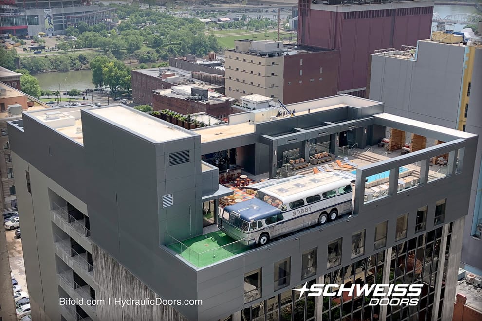 Bobby Hotel Bus Doors situated atop 10 story building