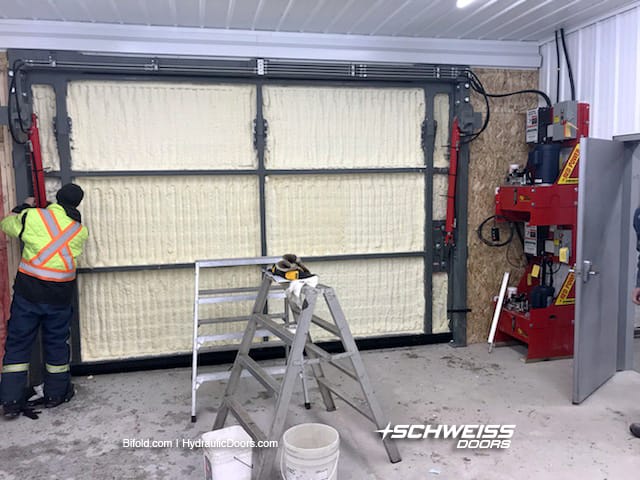 Both insulated hydraulic door's pumps are stack inside the storage/garage area