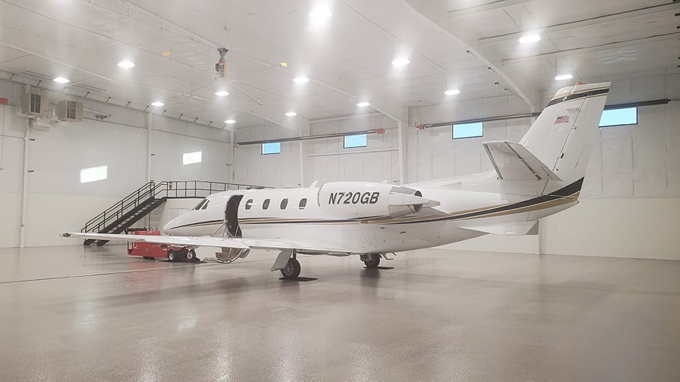 Citation jet named Cloudkisser parked inside hangar at Southern Wisconsin Regional Airport
