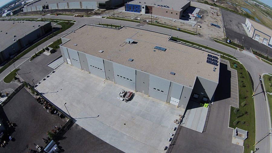 Industrial bifold doors help Calgary, CA manufacturer