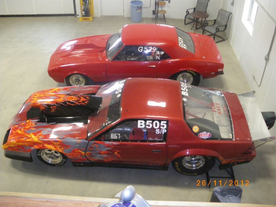 2 Drag Racing Cars inside garage