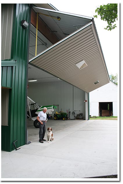 Trusty dog, Tuffy likes to pal with Fuchs around the hangar, but prefers to get out and hunt pheasants with Gene even more.