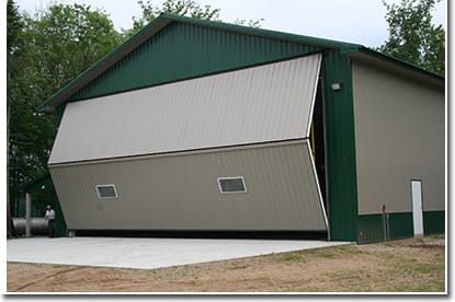 A grass landing strip sits just behind Fuchs farmsite grove. He's able to wheel out there rightfrom his bifold hangar door.