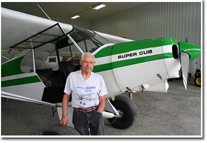 Fuchs stands by one of his awsome looking planes.