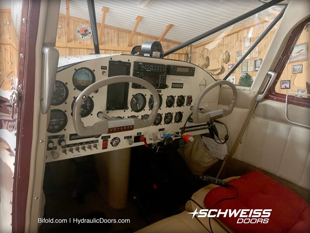 The inside of the Stinson looking out at Schweiss Hangar Door