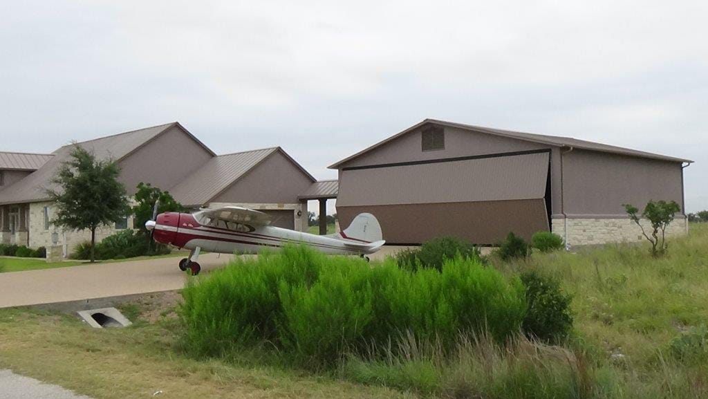 Texas Hangar Home, Horseshoe Bay | Schweiss Must See Photos  Overheard compliment convinces Texas hangar owner to go Strap Bifold