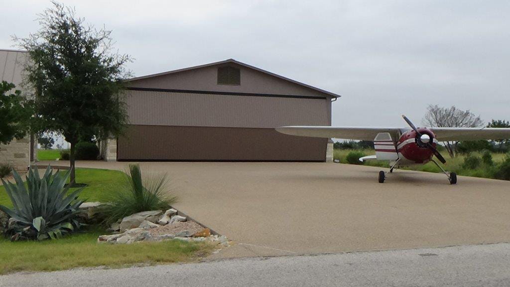 Texas Hangar Home, Horseshoe Bay | Schweiss Must See Photos  Seeing the door in action with the Cessna 195 out front