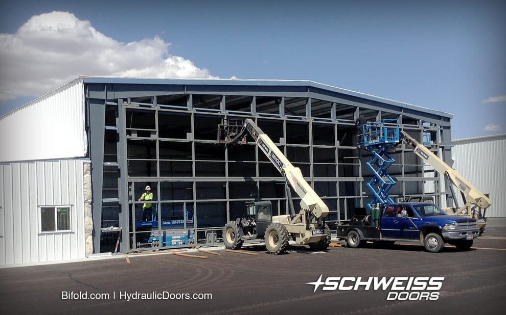 Schweiss Bifold Hangar Door has autolatches, windrated for 120mph and its well insulated.