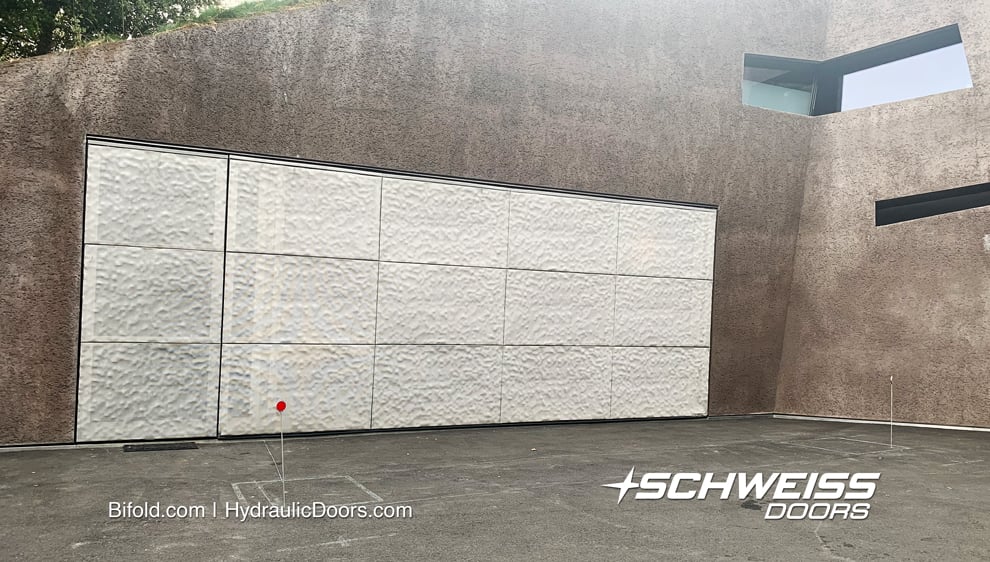 Schweiss hydraulic door used for garage entrance fitted on the Kramlich residence shown closed