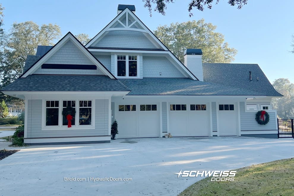 Hydraulic lifting boat garage door hides in this South Carolina island home