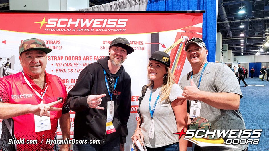 Mike Schweiss, Matt Faupel, and two owners of Maui Garage Doors posed in front of Schweiss Doors booth at IDA convention.