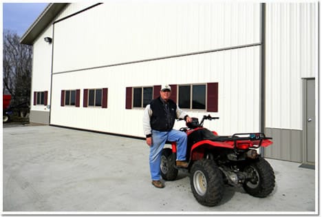 Bob Melhouse outside new farm shop's Schweiss door