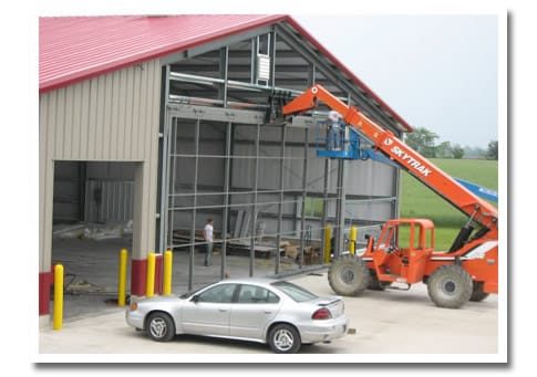 Schweiss Red Power Door being hung