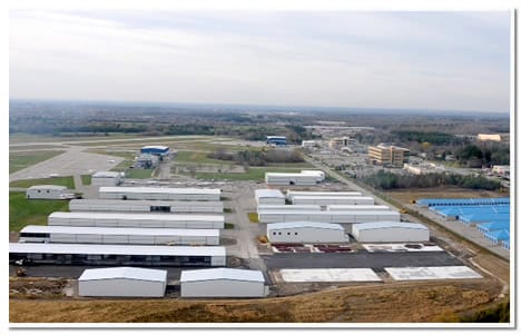 Rows of t-hangars and several box hangars at Oshawa Airport