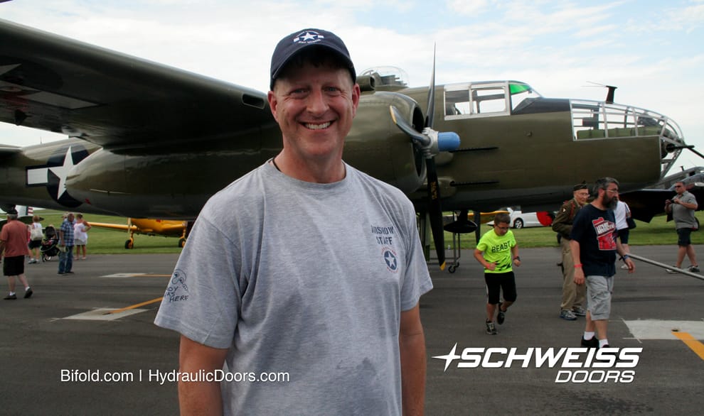 Fowler takes photo infron of B-25 bomber