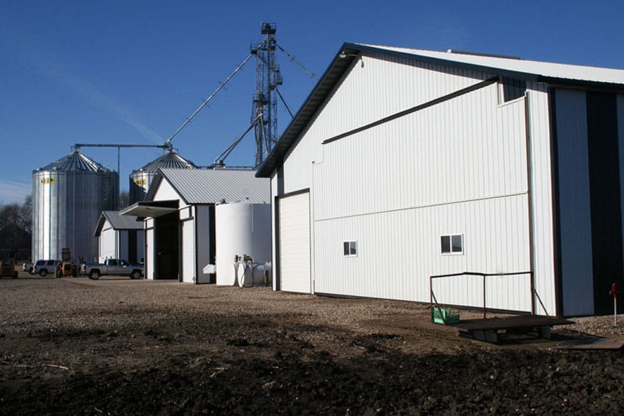 Farmsite buildings with Schweiss liftstrap doors are lined up for easy access