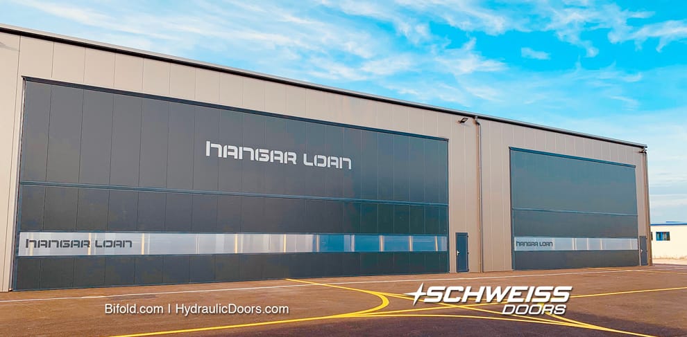 Building Contractors, in Vienna Austria, ordered five Schweiss bifold liftstrap hangar doors up to 19.3m wide and 7.2m tall