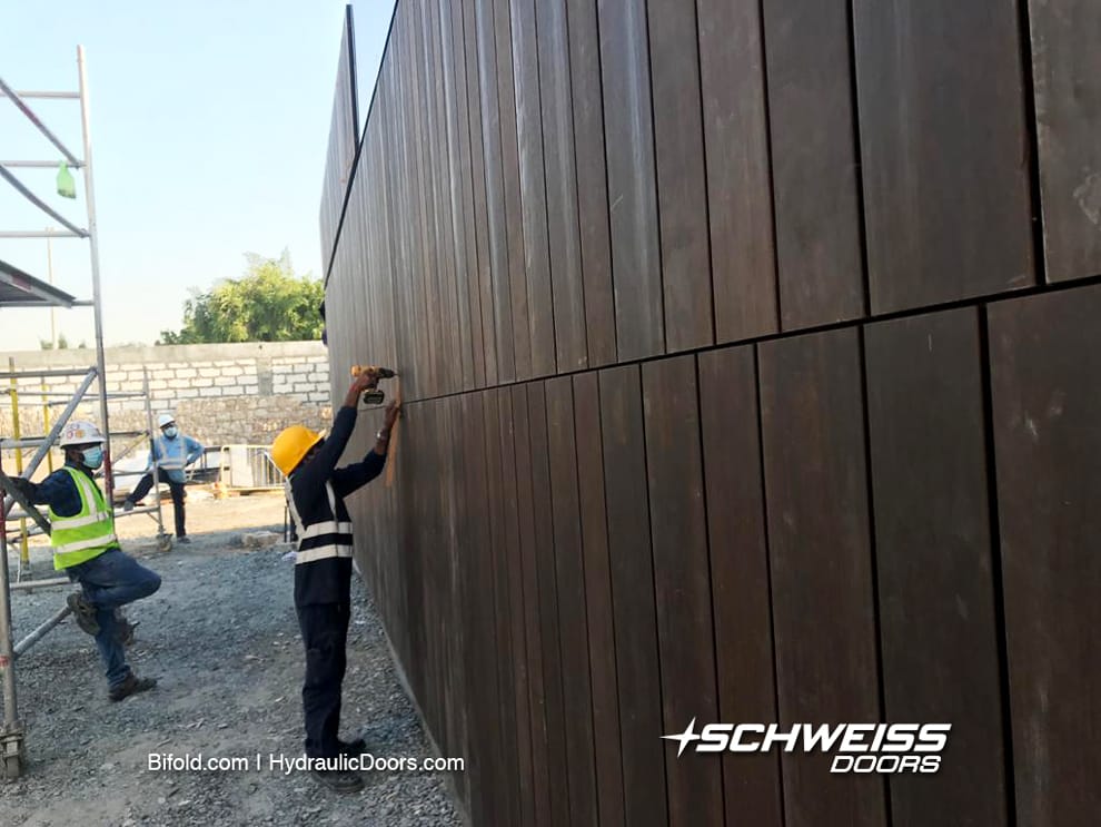 Schweis Door in Dubai gets wood slat cladding