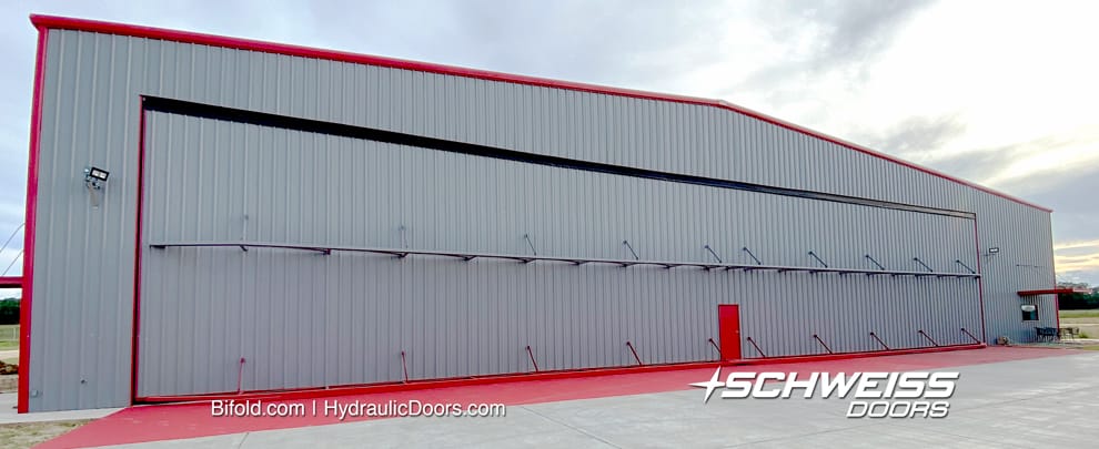 100 by 150 ft hangar with 115 ft Schweiss Hydraulic Door