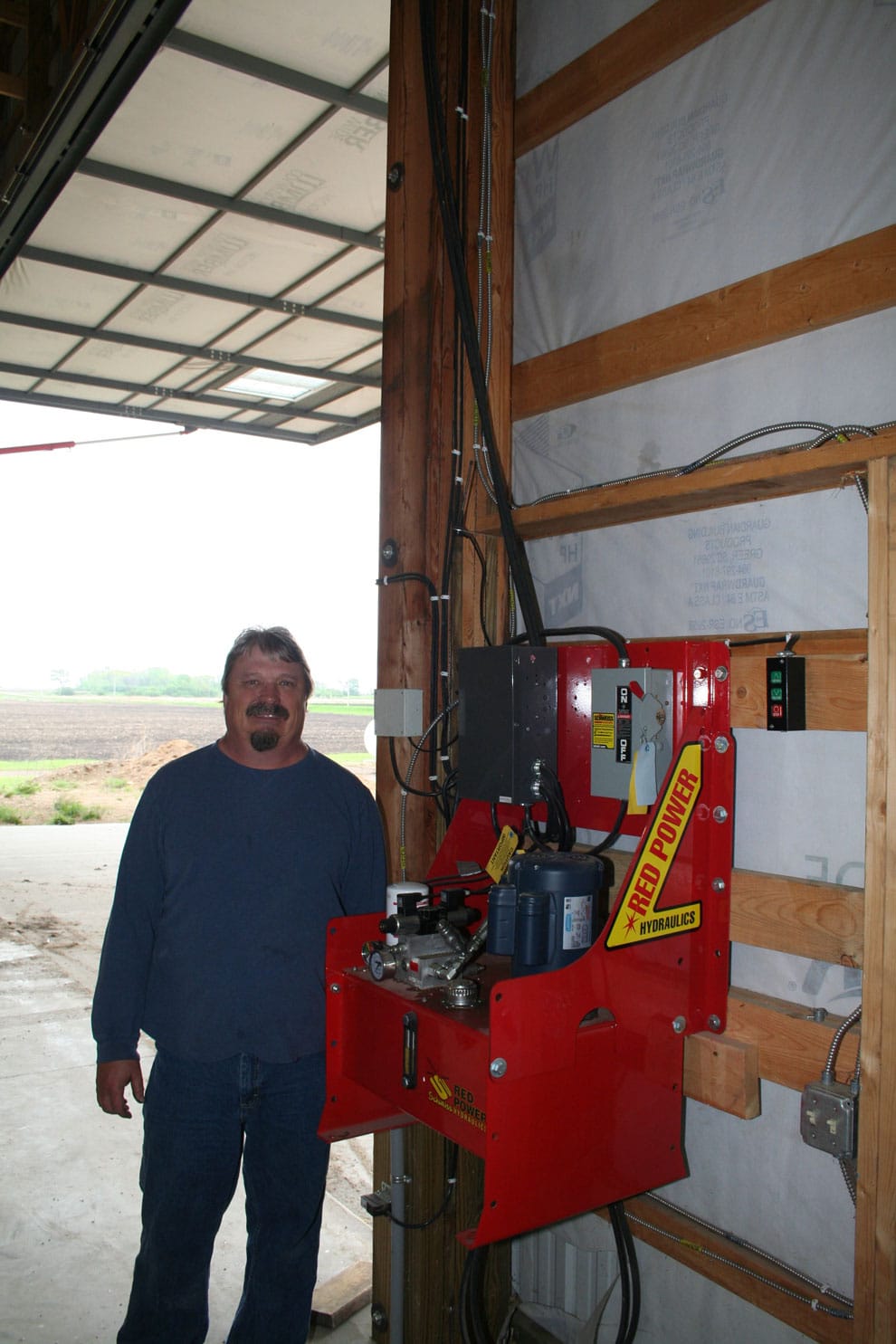 Red Power hydraulic pump conviently near the door