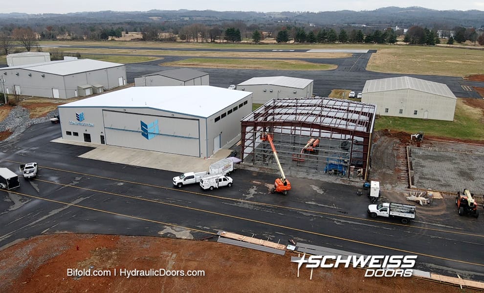 Aerial photo of SEI hangars at Morristown Regional Airport while Schweiss bifold door frame is being installed