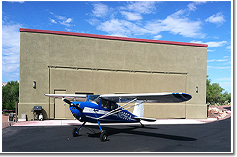 Hydraulic One-Piece hangar door gives shade when open