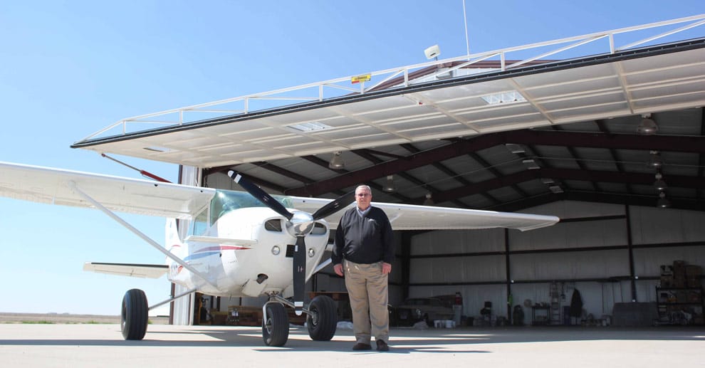 Hydraulic hangar door large enough to store farm equipment in the hangar