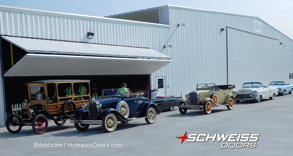 Exterior view of Schweiss bifold door fitted on one of WAAAM's hangars during Hood River Traffic Jam Car Show