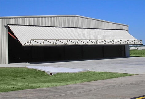 Schweiss hydraulic door gives access through the building's endwall