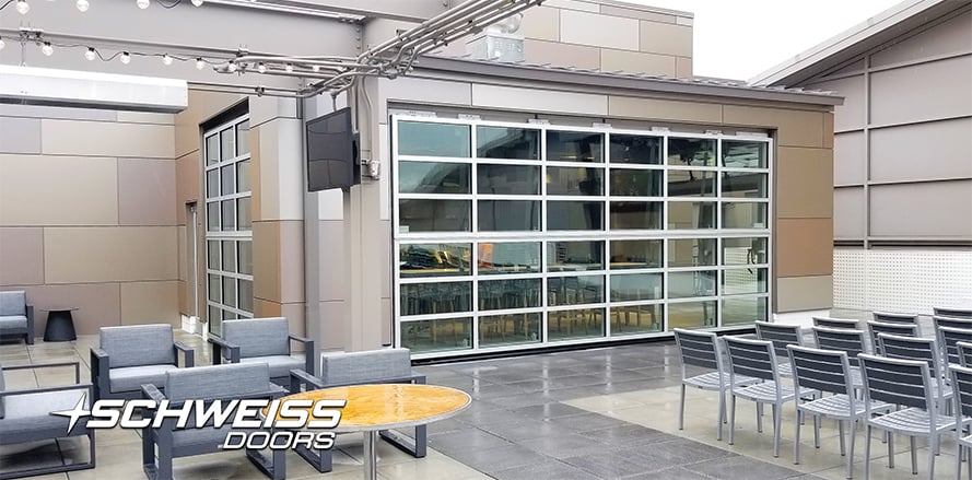 Schweiss doors connect patio and indoors at Performance Center