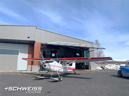 Schweiss hangar door opens to let out seaplane