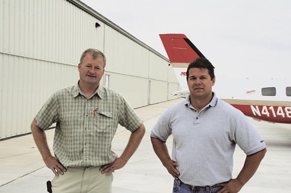 Jim Bult and Jeff Graefer in front of Schweiss Bifold Doors