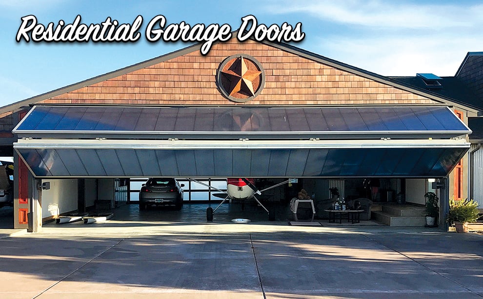 Schweiss Aviation garage Door with Blue Polycarbonate exterior in Oregon
