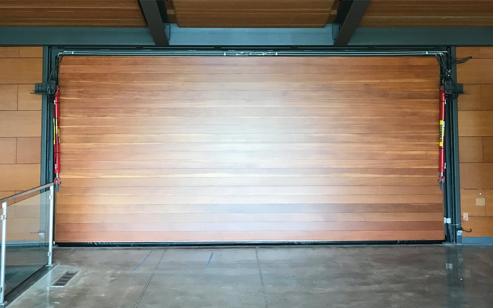 Schweiss hydraulic garage door's interior is lined with wood