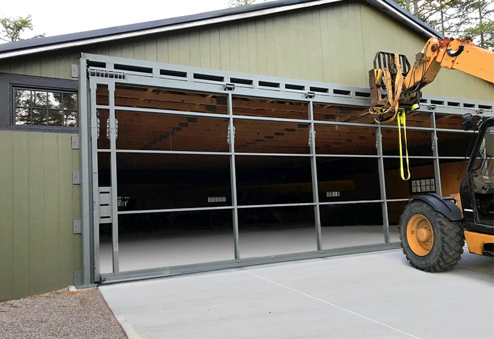 Installation of a Schweiss bifold door with a freestanding header