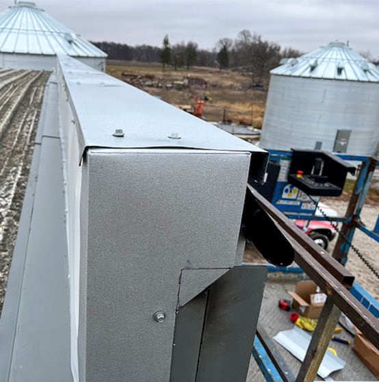 Side view of a Schweiss Door with Freestanding Header Extending Above Roof