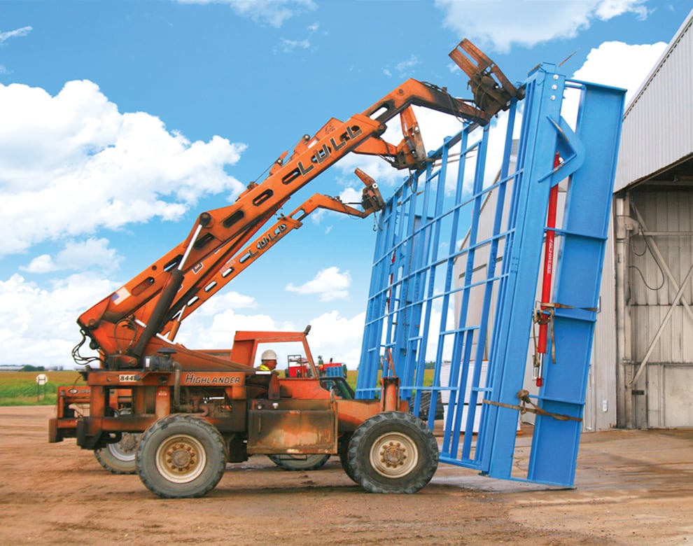 Schweiss Stand Alone Door With Freestanding Header Framework Being Mounted on Building