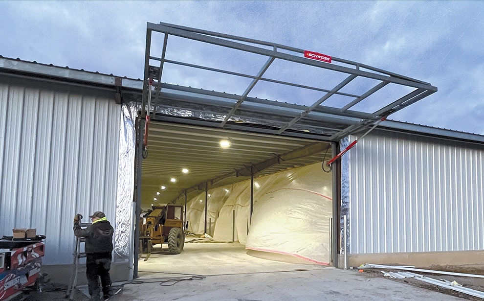 Alabama hydraulic door frame by Schweiss installed on building