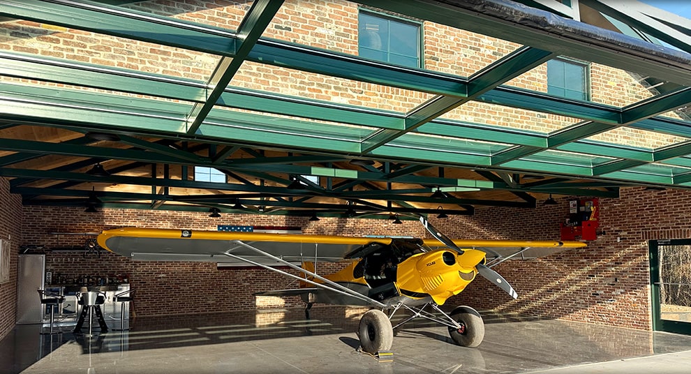 Georgia glass hydraulic door by Schweiss fitted on a hangar