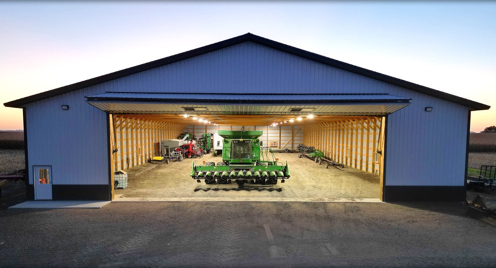 Combine in farm building fitted with Nebraska machine shed bifold door by Schweiss