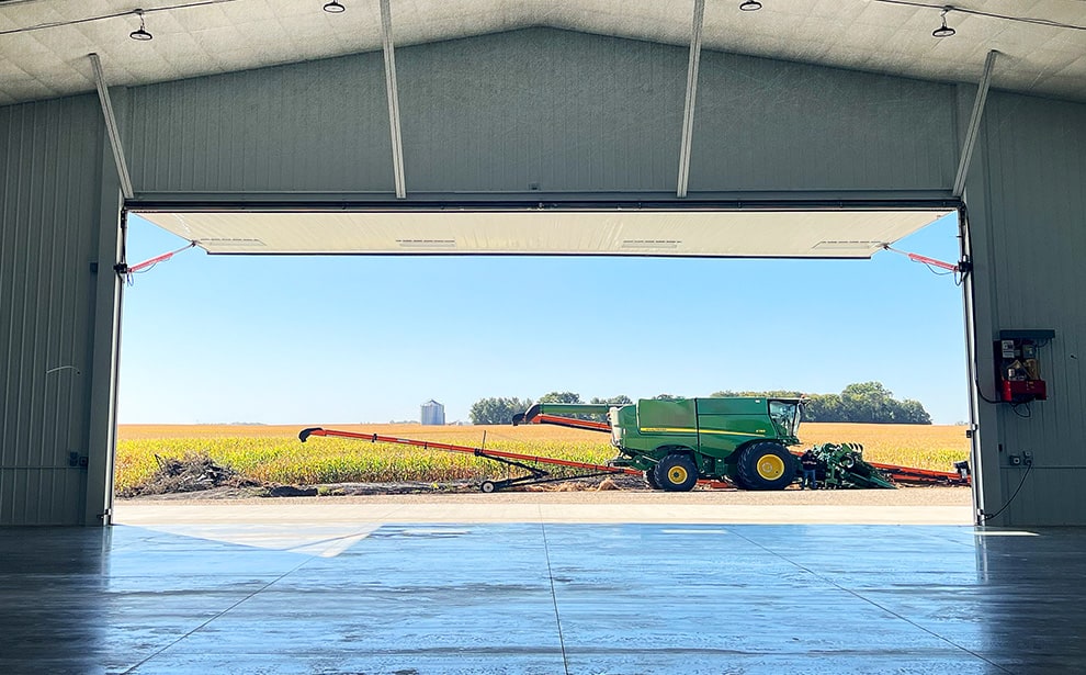 Interior view of open Nebraska hydraulic door frame by Schweiss installed on farm building