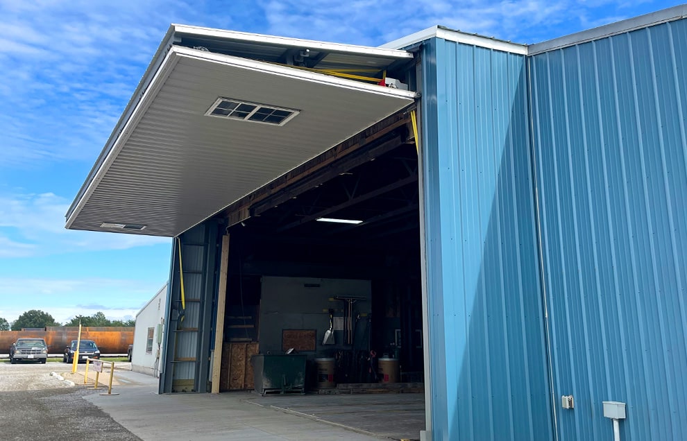 Nebraska bifold door by Schweiss installed on building shown open